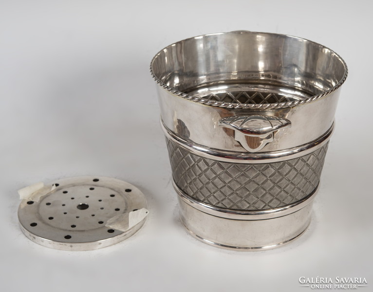 Silver champagne bucket with stylized shell pliers