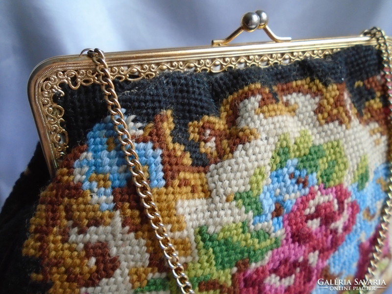 Tapestry bag. Colorful roses and flowers on a black background.