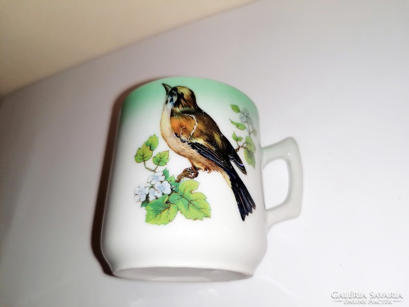 Antique birdie collecting coffee cup