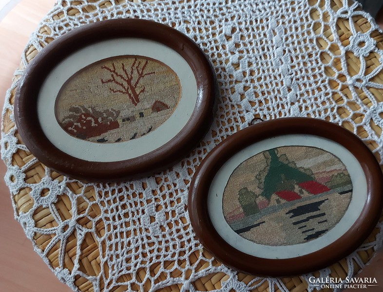 Antique needle tapestry with a tapestry oval frame and a pattern depicting elaborate landscapes