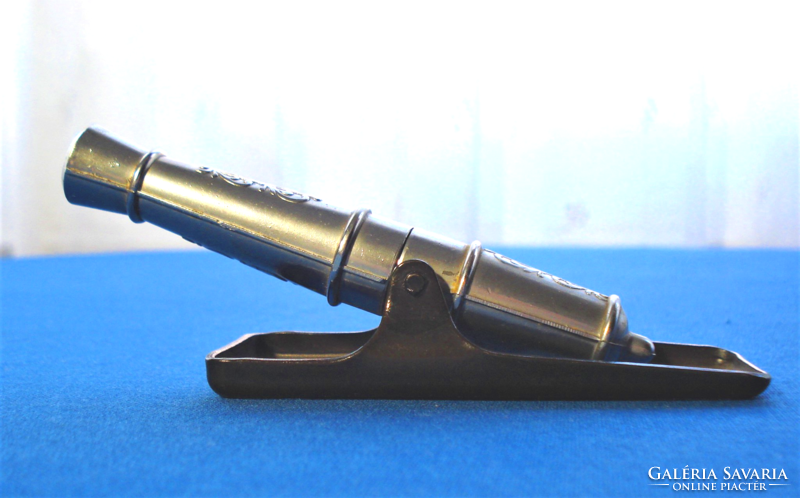 Retro, cannon-shaped metal corkscrew and bottle opener