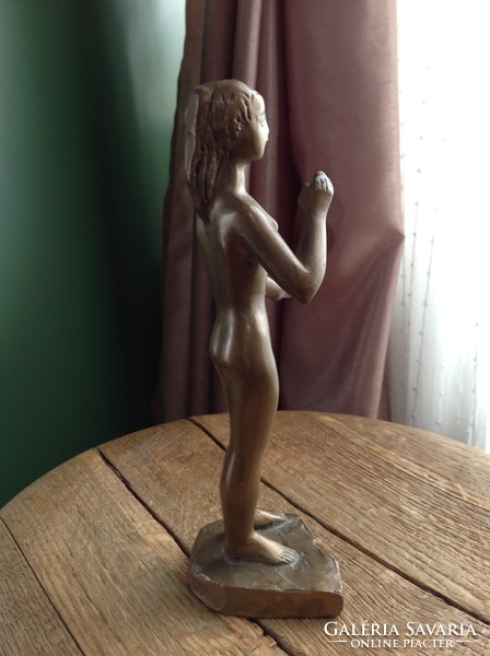 Old danger present copper statue of female nude