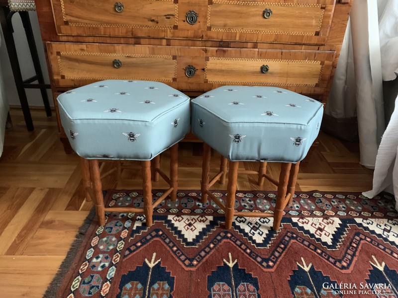 Two upholstered hard stuffed puffs / tables with fly covers