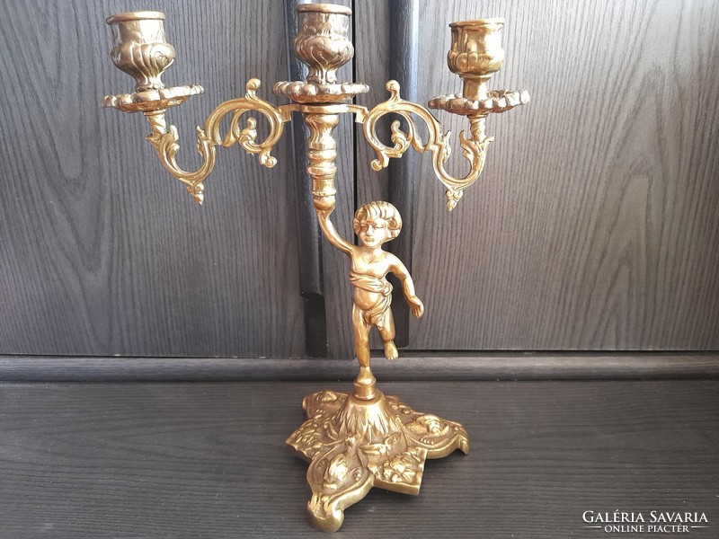 Old copper putto candle holder
