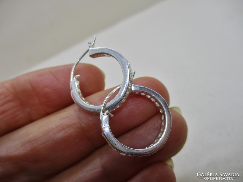 Elegant silver hoop earrings with white stones