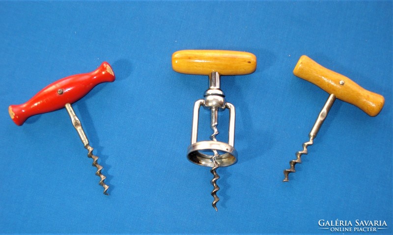 3 old corkscrews with wooden handles