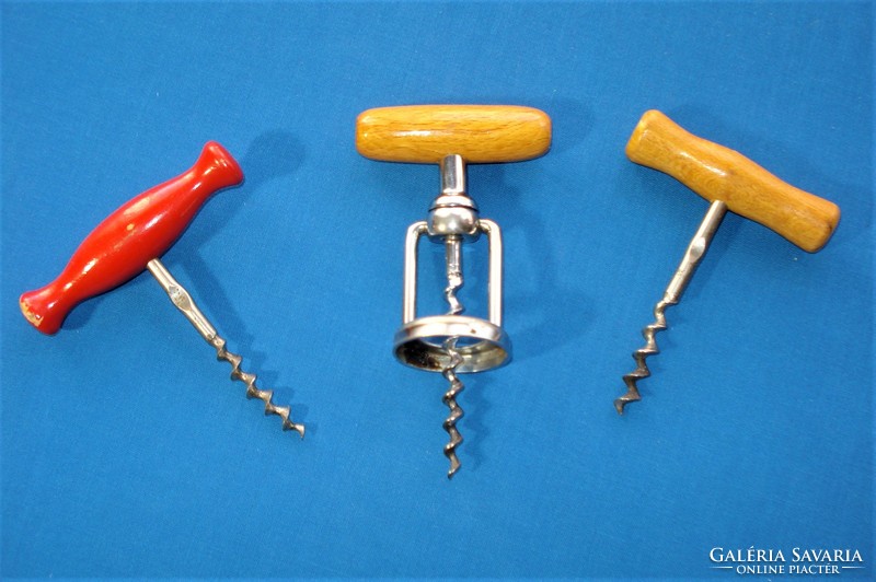 3 old corkscrews with wooden handles