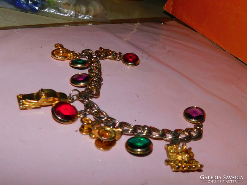 Unique old gilded bracelet with car-tricycle-locomotive pendants