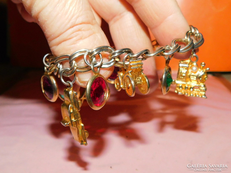 Unique old gilded bracelet with car-tricycle-locomotive pendants