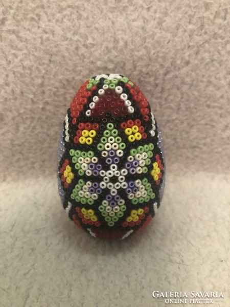 Beaded ornament with eggs.