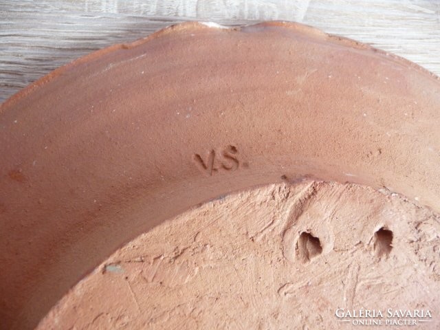 Sándor Varga measuring me on a ceramic wall bowl
