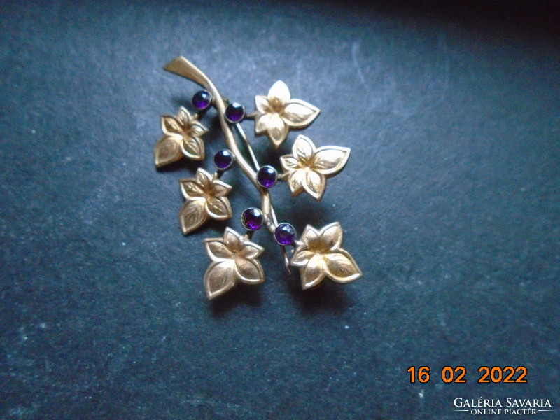 Antique gold-plated brooch with dark purple faceted stones
