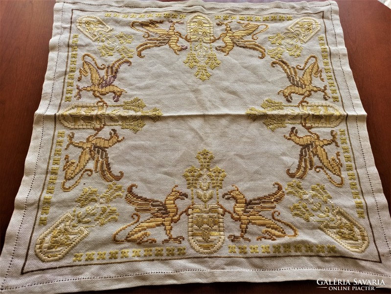 Embroidered tablecloth with griffin coat of arms