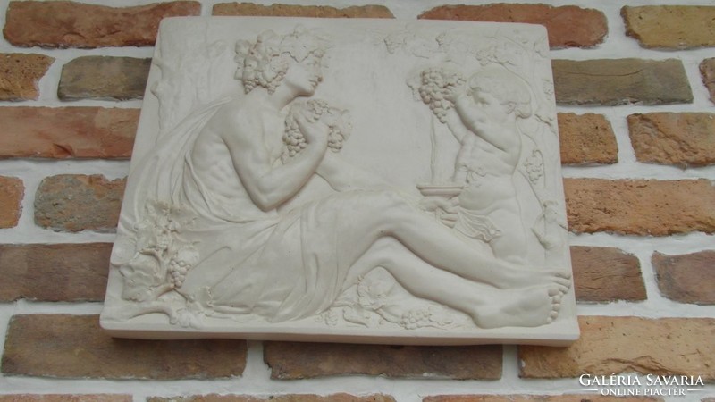 A stone tablet depicting a young bacchus, relief,