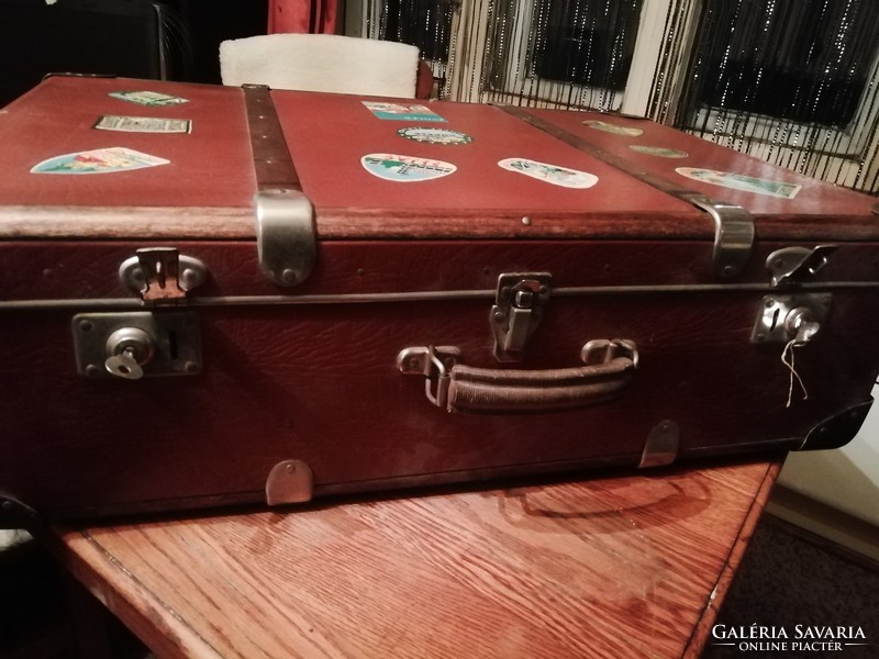 Antique travel suitcase with wooden sticker