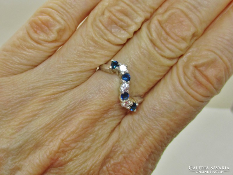 Beautiful wavy silver ring with blue and white stones