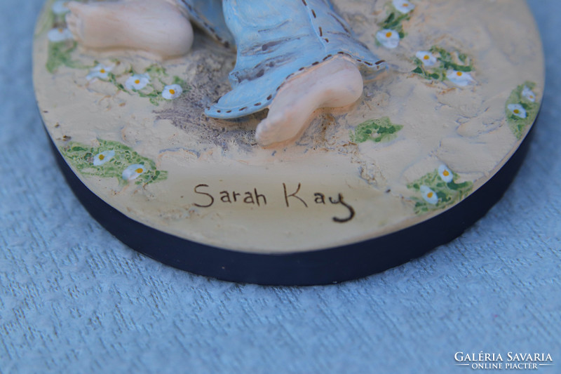Little girl with kitten. Sarah kay statue with certificate