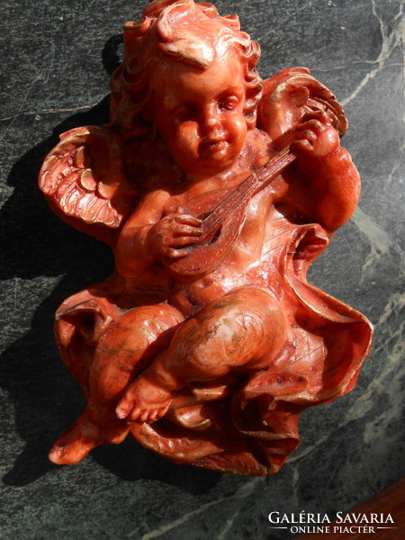 Large angelic wax wall ornament.