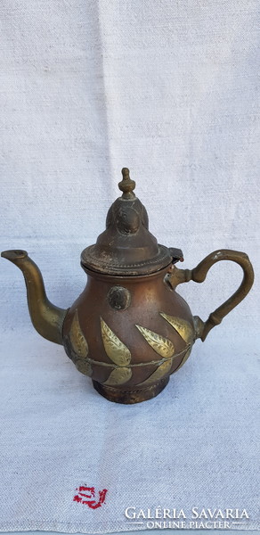 Antique ornate hand hammered oriental tea spout.
