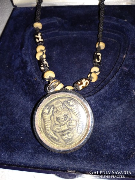 Necklace with tigers, embossed decoration, on braided cord