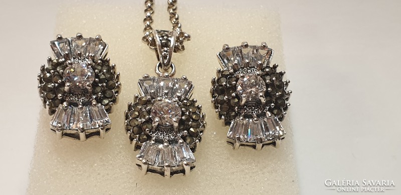 Silver necklace richly decorated with stones, pendant and earrings