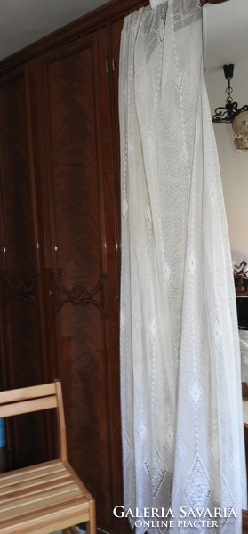 Eclipse lace curtain with geometric patterns