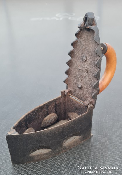 Old cast iron charcoal iron with lion head lock