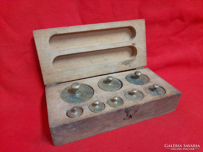 Old certified copper weight set in wooden box.
