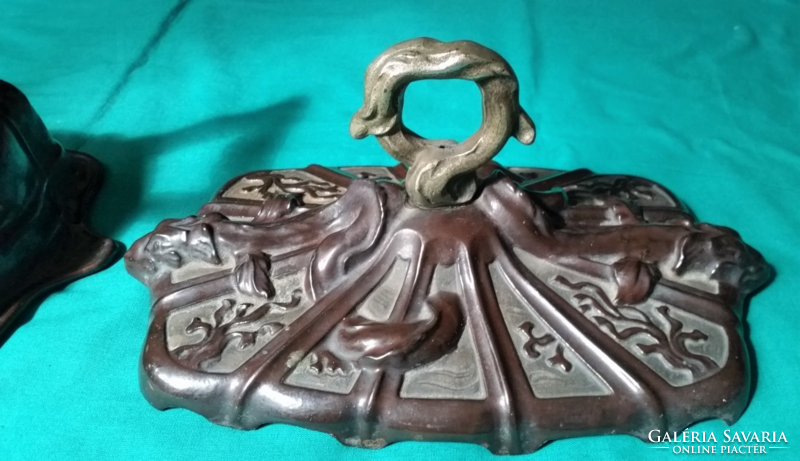 Antique dragon motif cast iron embers, stove, coal holder in front of the fireplace