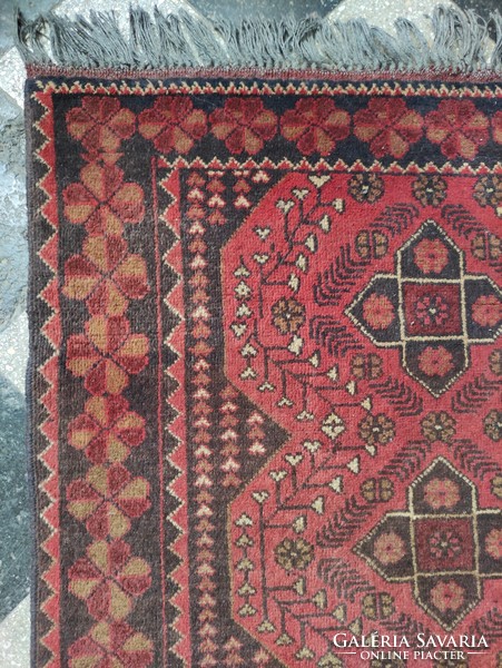 Red-toned hand-woven Afghan wool rug approx. 60 years old