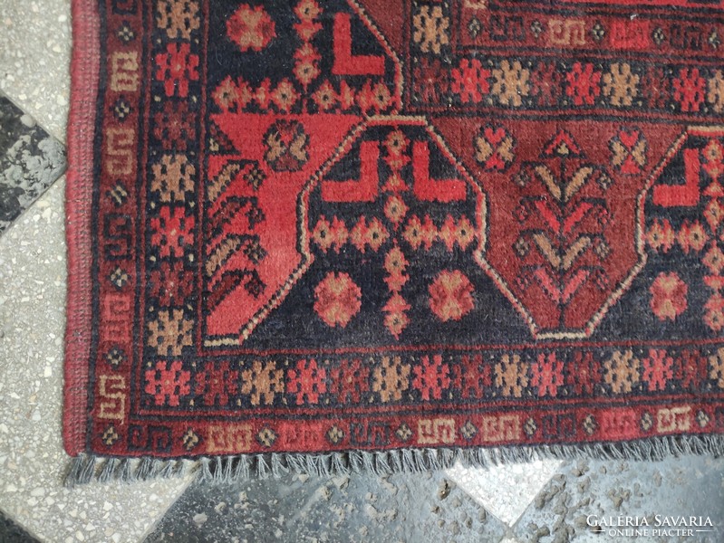 Red-toned hand-woven Afghan wool rug approx. 80 years old