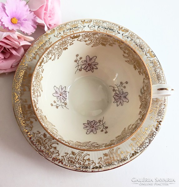 Gilded floral tea cup and saucer