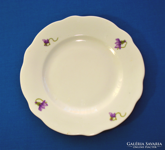3 small plates with a violet pattern