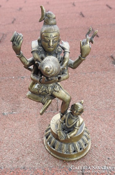 Antique bronze detail of three statues of oriental deities