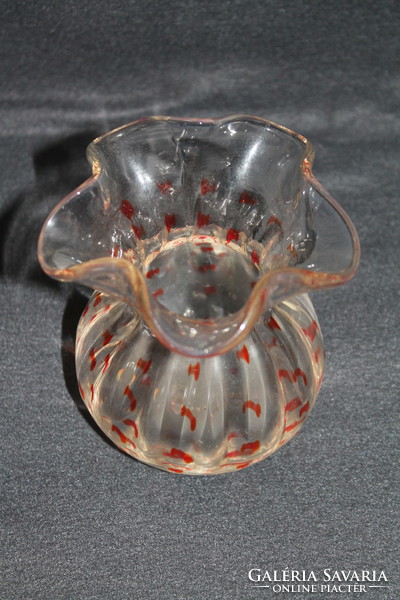 Old glass vase with orange stains