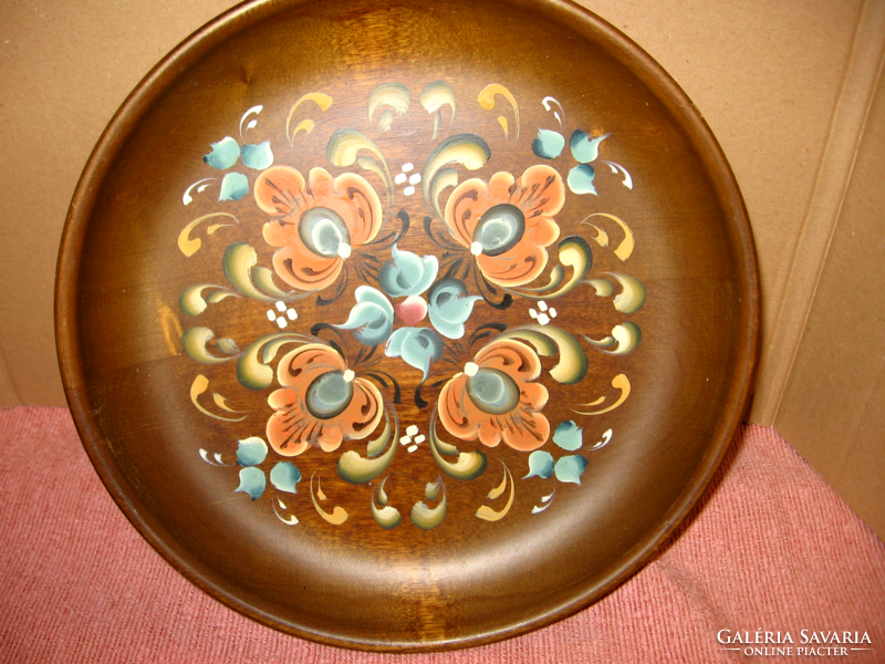 Norwegian old wall ornament on wooden plate, bowl