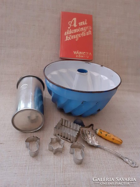 Old kitchen utensils in one enamel casserole oven spit, cookie cakes spoons cake book