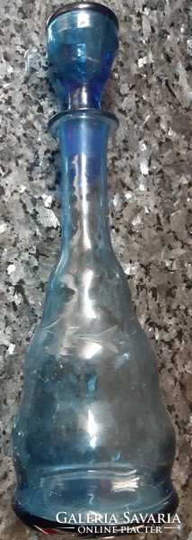 Liquor bottle with blue glass stopper