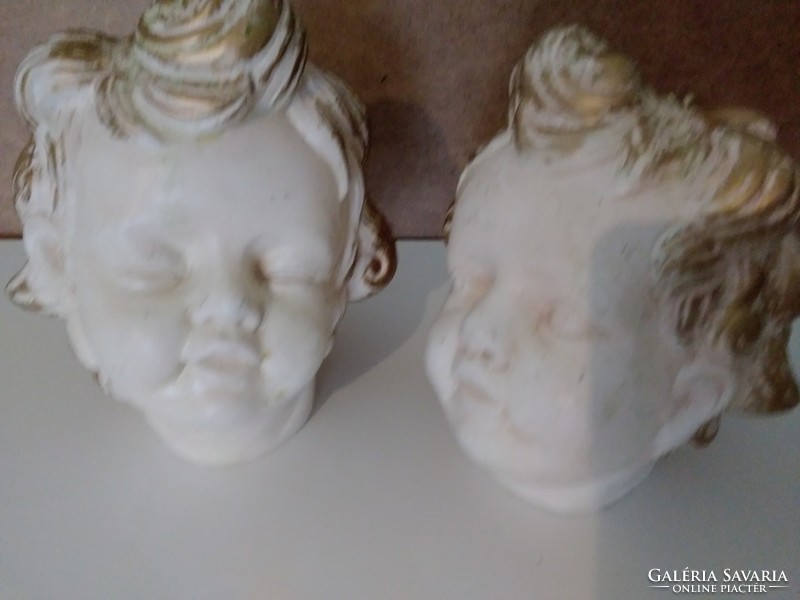 Ceramic putto heads