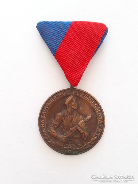An old medal of the home for the faithful service of the people is a badge