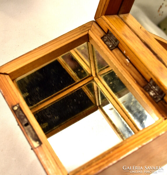 Inside antique wooden box with full mirror insert