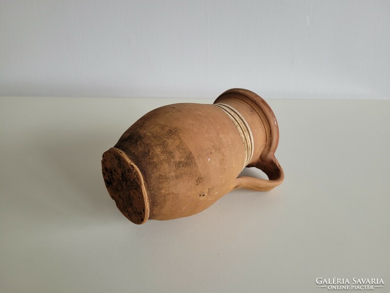 Old vintage glazed folk earthenware milk jug pot with handle jug earthenware jug