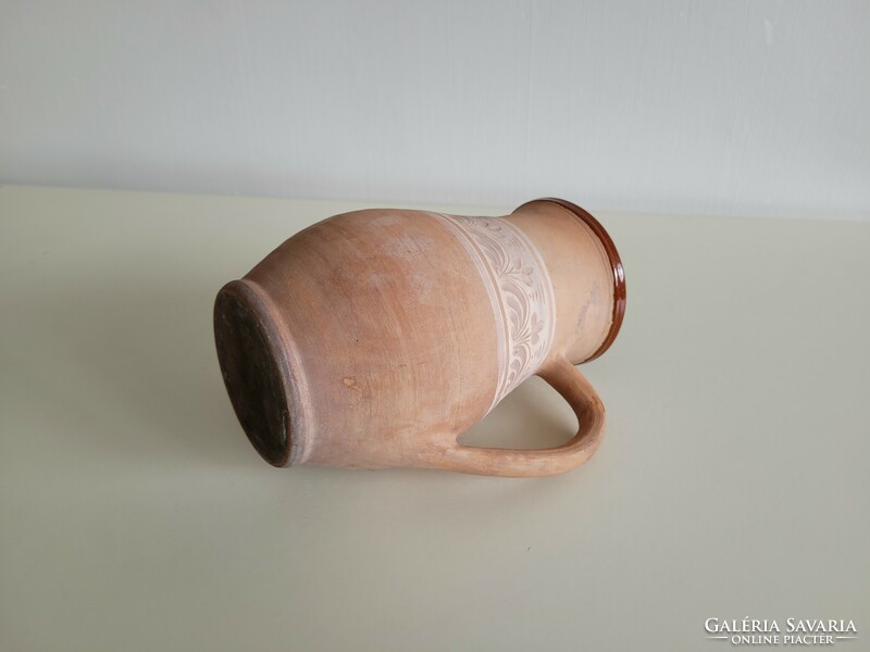 Old vintage flower pattern folk milk jug earthenware pot glazed pot jug with handle earthenware jug