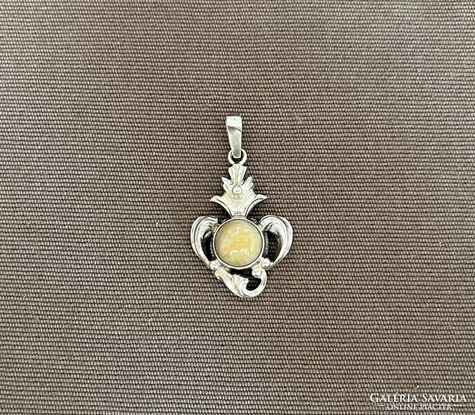 Silver pendant with mineral stones