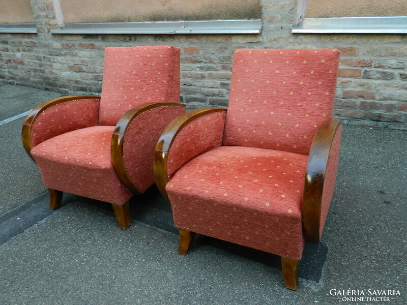 2 red armchairs together