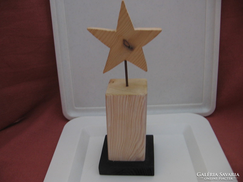 Christmas decoration with metal stars on wooden base