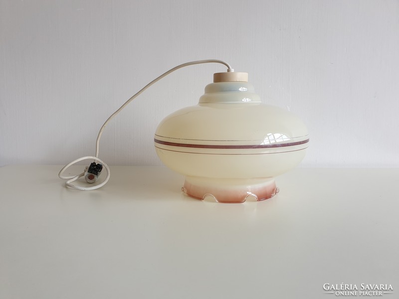 Old vintage ceiling glass lamp with curled lampshade