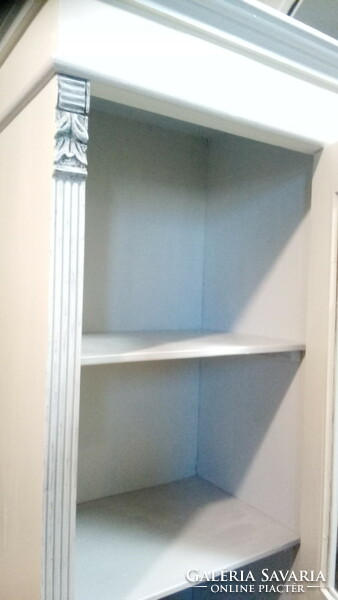 Narrow storage cabinet with Old German books
