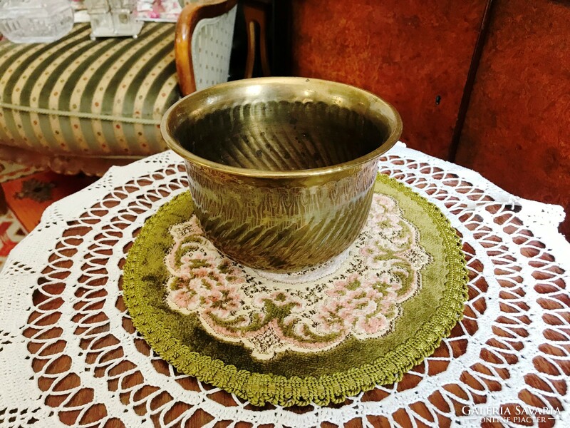 Old brass pot with a special shape and a smaller size