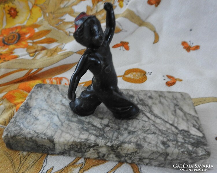 Antique nutmeg little boy statue on marble pedestal